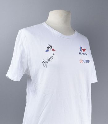 the white t - shirt has a picture of a bird on it