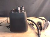 an image of a black speaker on a wooden table