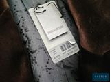 a tag that is attached to a tie on a piece of cloth