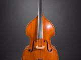 an old cello on a black background