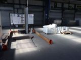 a large warehouse with a lot of items on the floor
