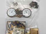 several items including a pocket watch, a lighter, and a lighter