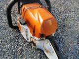 a close up of a chainsaw on the ground on the ground