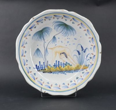 a close up of a plate with a bird on it