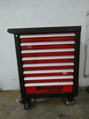 an image of a red and black tool cabinet in a garage