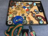 a case with a lot of medals and other items in it