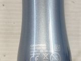 a close up of a bottle of liquid on a table