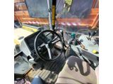 a view of the inside of a truck from the driver ' s seat
