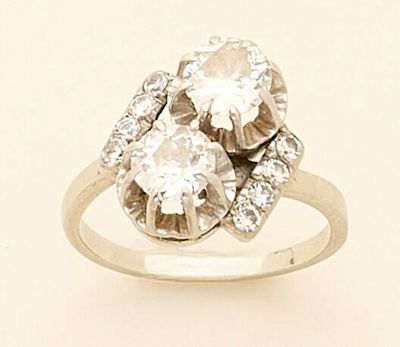 an image of a three stone diamond ring on a white background