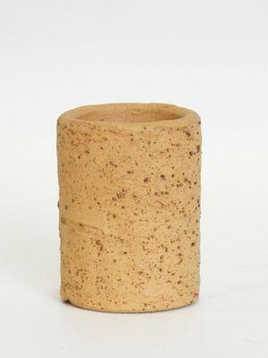 a wine cork that is sitting on a white surface
