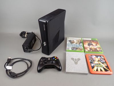 a video game console and a game controller on a table