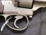 a gun that is sitting on a black cloth
