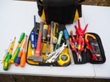 many different tools in the bag on the table