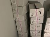 many boxes stacked on top of each other in a room