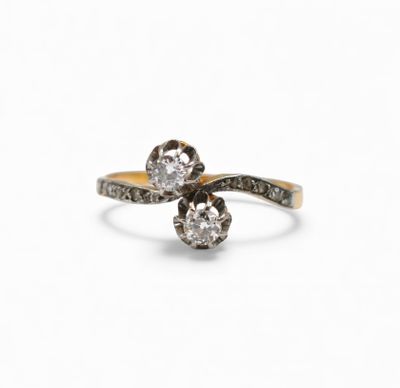a close up of a diamond ring on a white background