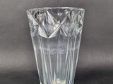 a glass vase that is sitting on a table