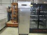 an image of a refrigerator in a store with other items in the background