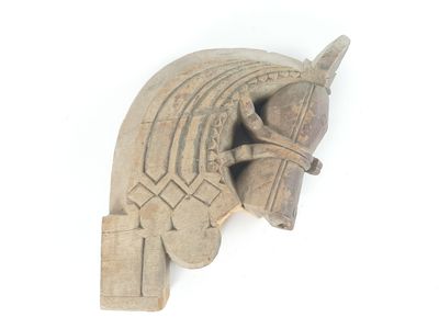a sculpture of a horse ' s head on the wall