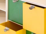 brightly colored drawers and shelves in a children ' s playroom