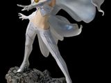 the statue of a woman in a white outfit is standing on a rock