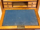 a small desk with a blue mat on it
