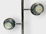 two lights that are on the side of a pole