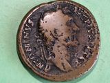 a close up of a coin on a green surface