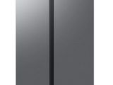 a silver refrigerator freezer sitting on top of a white surface