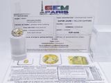 an image of a picture of a yellow sapphire in a clear box