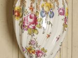 a vase that is sitting on a table in a room