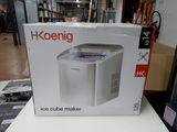 boîte contenant une machine à glaçons, posée sur une table dans un magasin