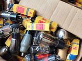 a cardboard box filled with assorted kitchen utensils and cooking utensils