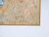 a picture of a painting hanging on the wall above a bed