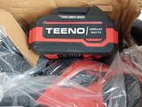 a red and black tool in a cardboard box