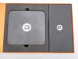a box with a phone inside of it on a table