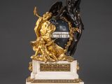 an image of a statue of a man and woman on a marble base