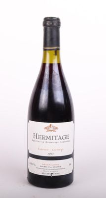 a bottle of wine that is sitting on a table