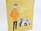 a yellow suitcase with a picture of a man and a car on it