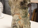 a ceramic bear that is sitting on a table