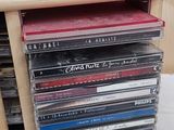a stack of cd ' s sitting on top of a table
