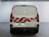 a white van with red and white stripes parked in a room