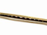 gold plated hair clip on white background