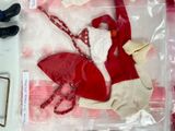 a plastic bag with clothes and shoes in it