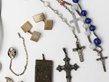 a lot of religious items that are laying out on the table
