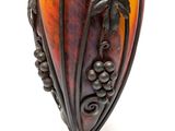 a vase that is sitting on a stand on a white surface