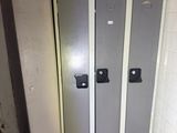 two lockers in the corner of a bathroom