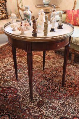 a small table with a lot of figurines on it