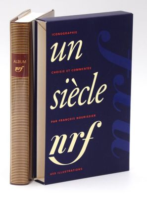 books are stacked on top of each other on a white surface