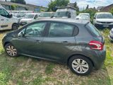 a car that is parked in the grass near other cars