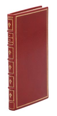 un livre rouge avec des bordures dorées et orné de bordures dorées
